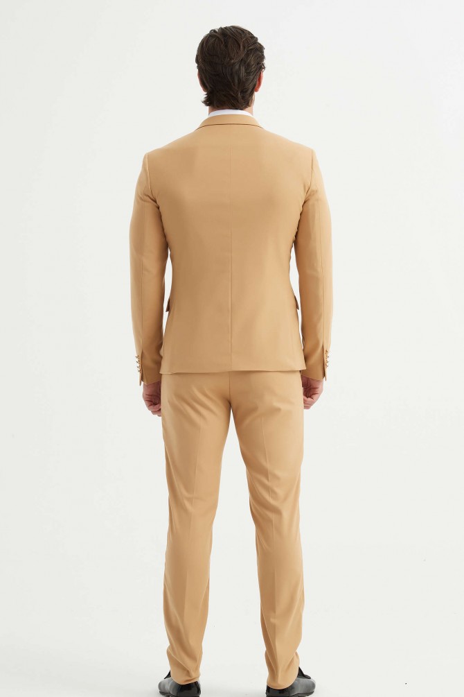 Double breasted suit in sand