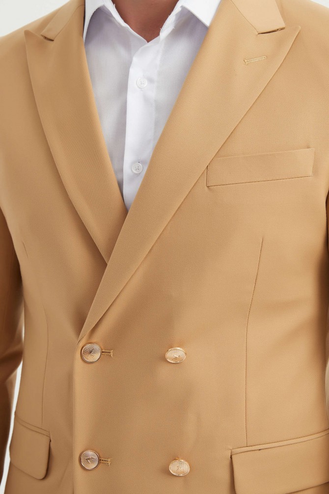 Double breasted suit in sand