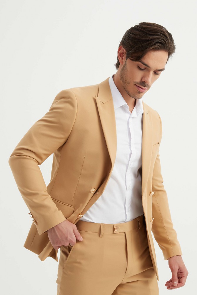 Double breasted suit in sand